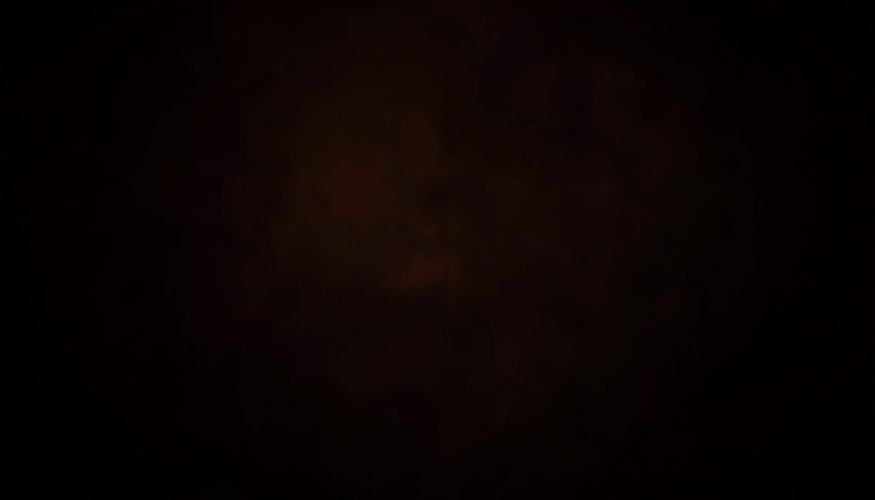 Dark atmospheric background with rich chocolate tones and subtle warm highlights, moody and luxurious